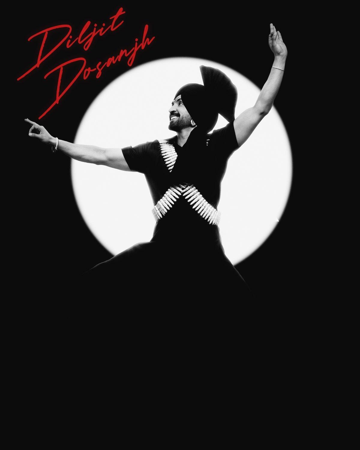 Diljit Dosanjh silhouetted against a full moon, arms outstretched